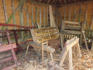 'Bodger's camp', showing a shave horse and some fence panels and hurdles that have been made.